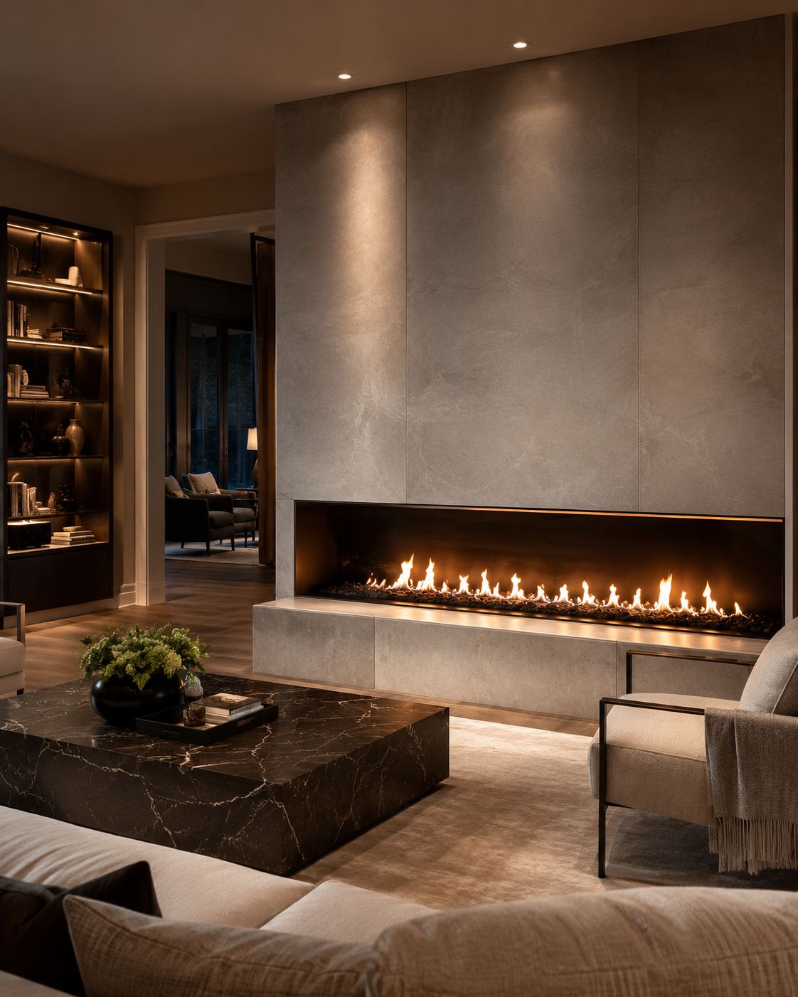 Wide linear gas fireplace set into a stone feature wall in a modern living room